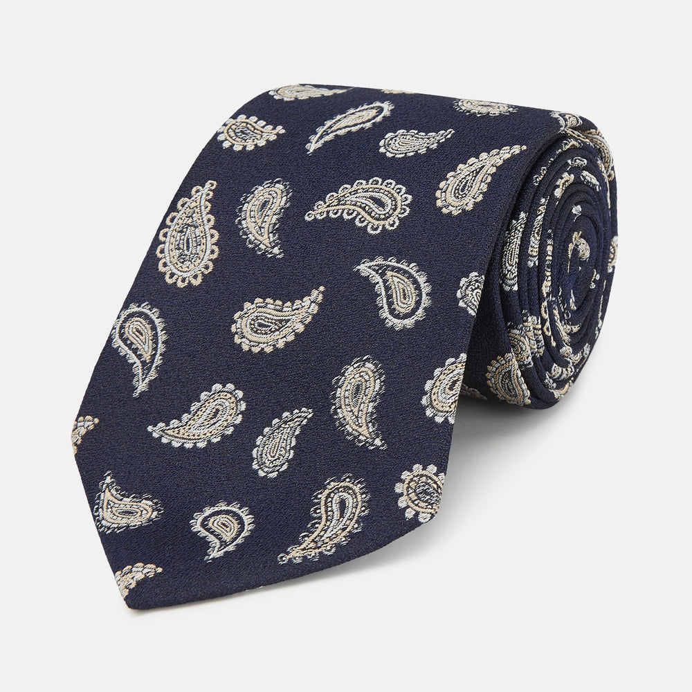 The Black Renoir Paisley Tie by Turnbull & Asser features intricate paisley patterns, making it a sophisticated addition to any outfit.