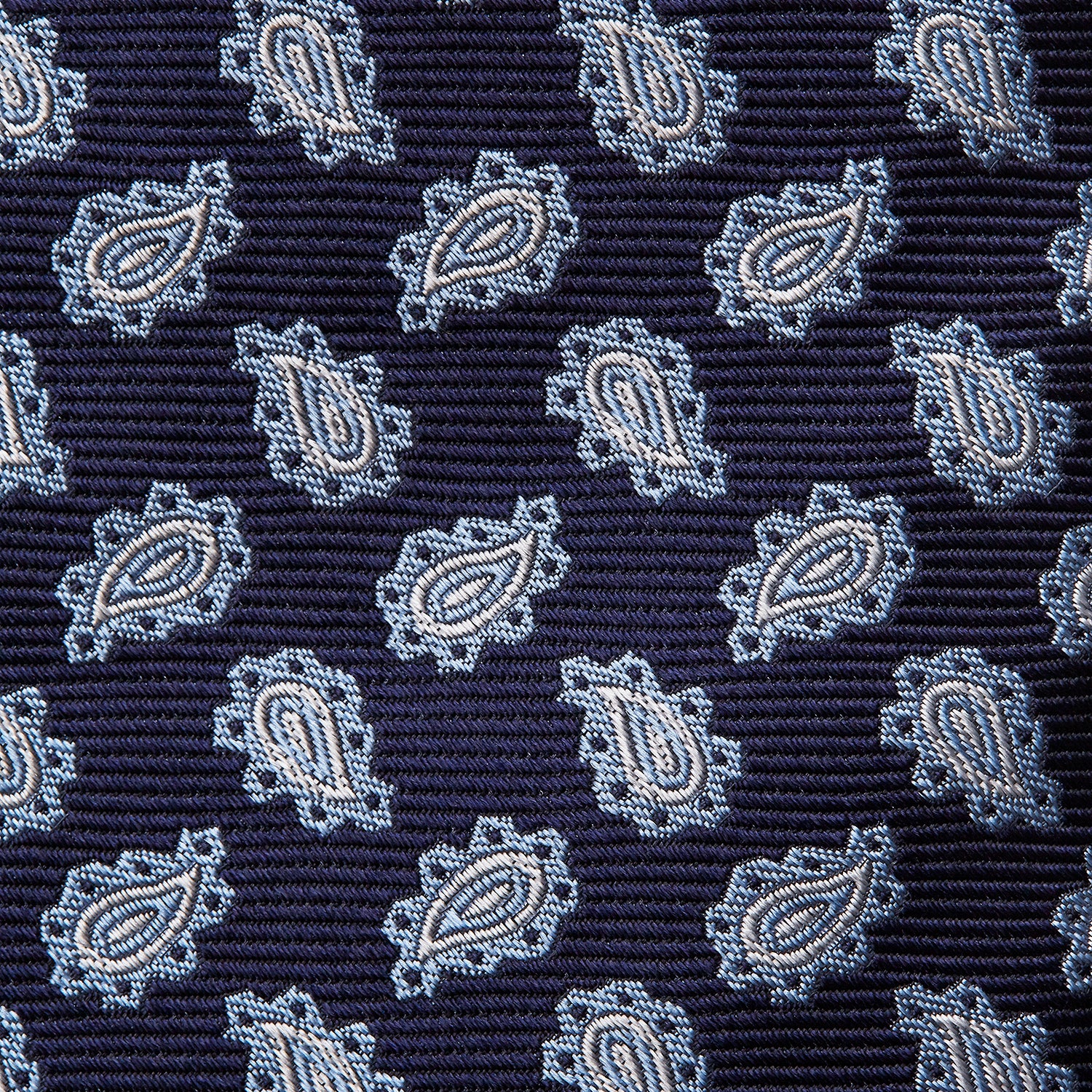 View 3 of product The Blue Abstract Paisley Silk Tie by Turnbull & Asser features a classic paisley motif in navy, offering a timeless touch to your wardrobe and perfectly capturing traditional elegance.