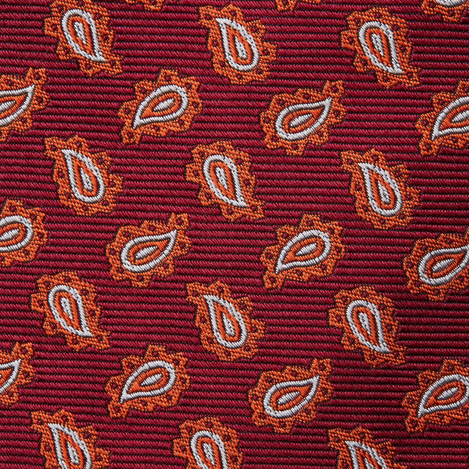 View 3 of product The Turnbull & Asser Red Abstract Paisley Silk Tie features bold orange and white paisley patterns on rich red silk—a stylish choice for fans of classic tailoring.