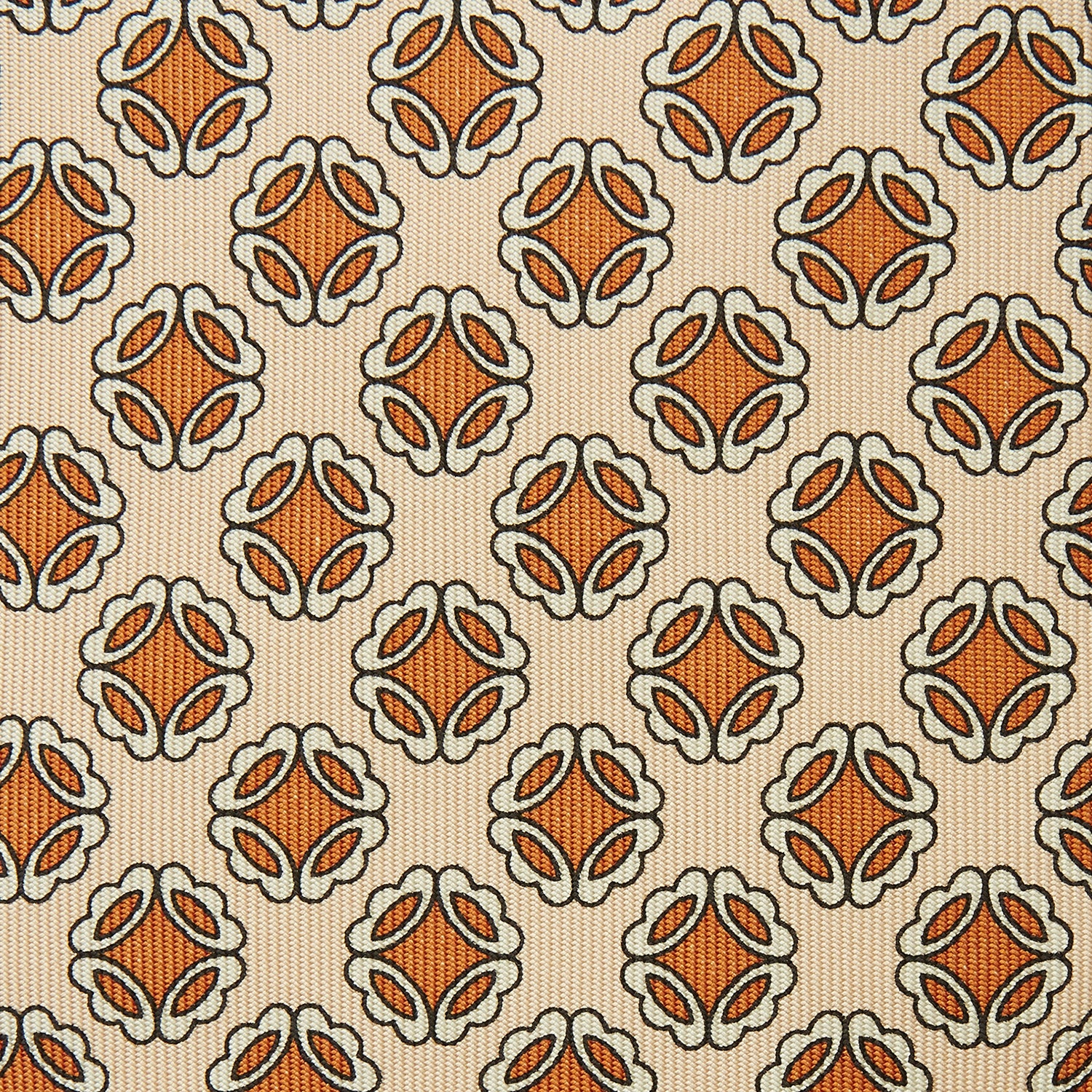 View 3 of product A cream floral geometric tie by Turnbull & Asser, rolled with the pointed end forward, is displayed on a white background.