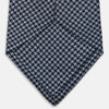 View 4 of product The Turnbull & Asser Blue Houndstooth Silk Tie, shown rolled on a plain white background, adds a refined touch to any sophisticated wardrobe.