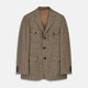 The Byron Wool Check Travel Jacket by Turnbull & Asser features a brown plaid pattern, notched lapel, four flap utility pockets, and dark buttons. This lightweight wool jacket is shown on a plain white background.