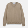 View 1 of product The Beige Paden V-Neck Jumper by Turnbull & Asser, made of pure cashmere, features long sleeves and ribbed cuffs and hem. It is shown flat on a white background with the label visible at the neckline.