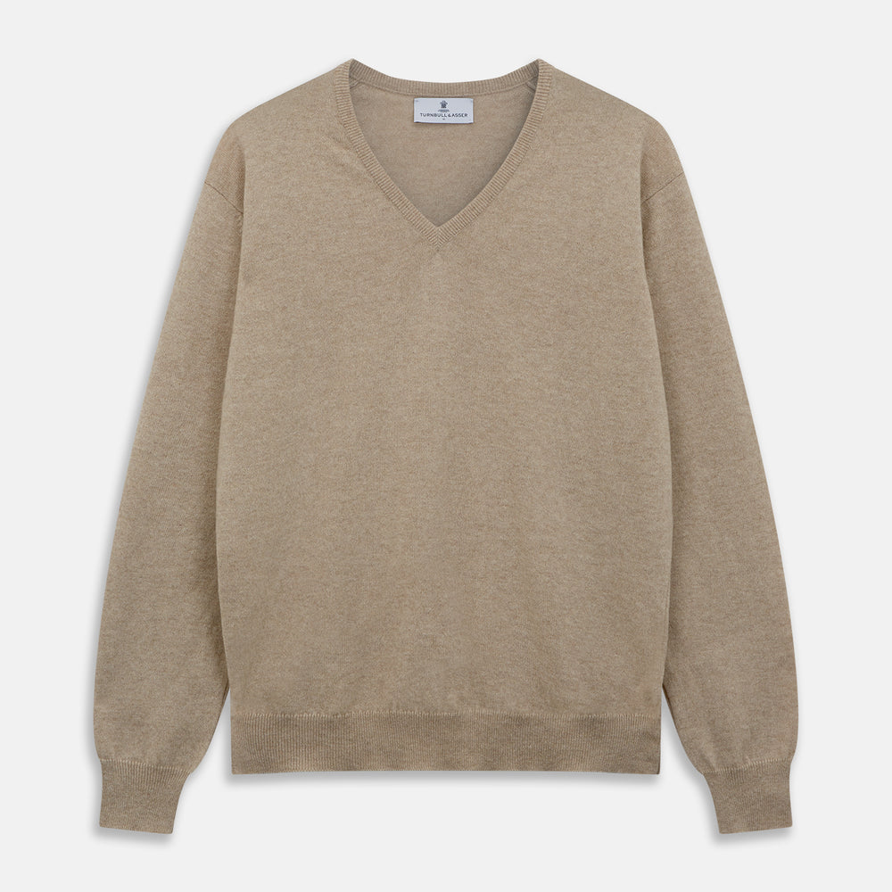 The Beige Paden V-Neck Jumper by Turnbull & Asser, made of pure cashmere, features long sleeves and ribbed cuffs and hem. It is shown flat on a white background with the label visible at the neckline.