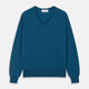 The Turnbull & Asser Ocean Blue Merino Kennedy V-Neck Jumper, shown flat on a white background, features ribbed cuffs and hem with a visible branded label at the neckline.
