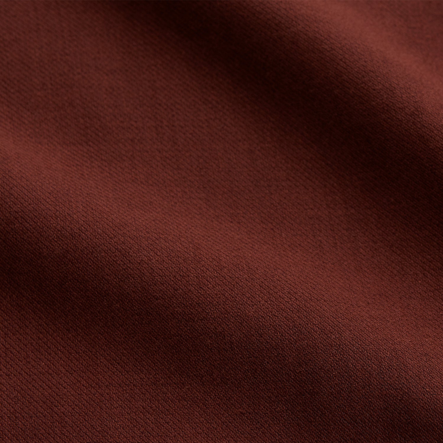 View 5 of product The Turnbull & Asser Red Cotton-Cashmere Pyjama Set features a rust-red long-sleeve button-up top with chest pocket and matching waist-tied pants, shown on a plain white background.