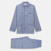 View 6 of product The Turnbull & Asser Blue Check Modern Cotton Pyjama Set features a long-sleeve button-up top and matching pants, crafted from thicker cotton for added comfort, shown against a white background.