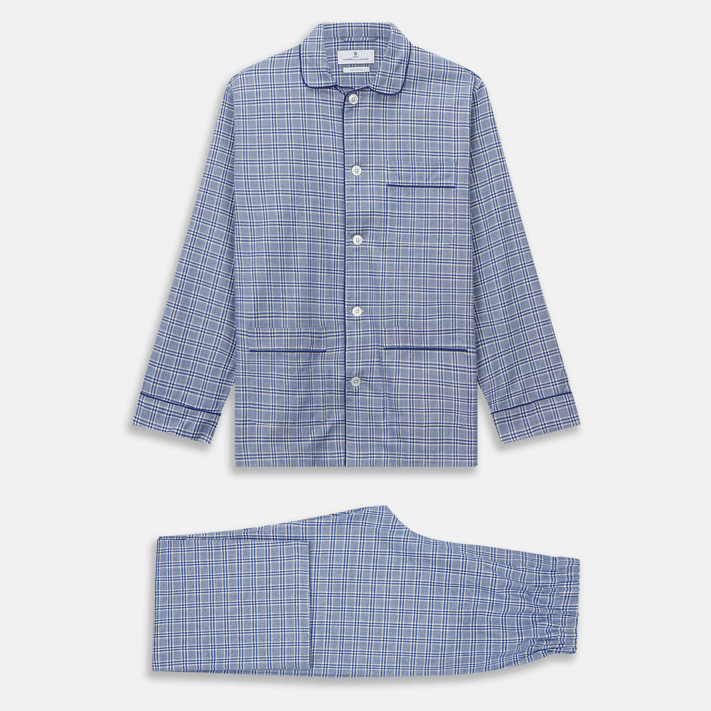 The Turnbull & Asser Blue Check Modern Cotton Pyjama Set features a long-sleeve button-up top and matching pants, crafted from thicker cotton for added comfort, shown against a white background.