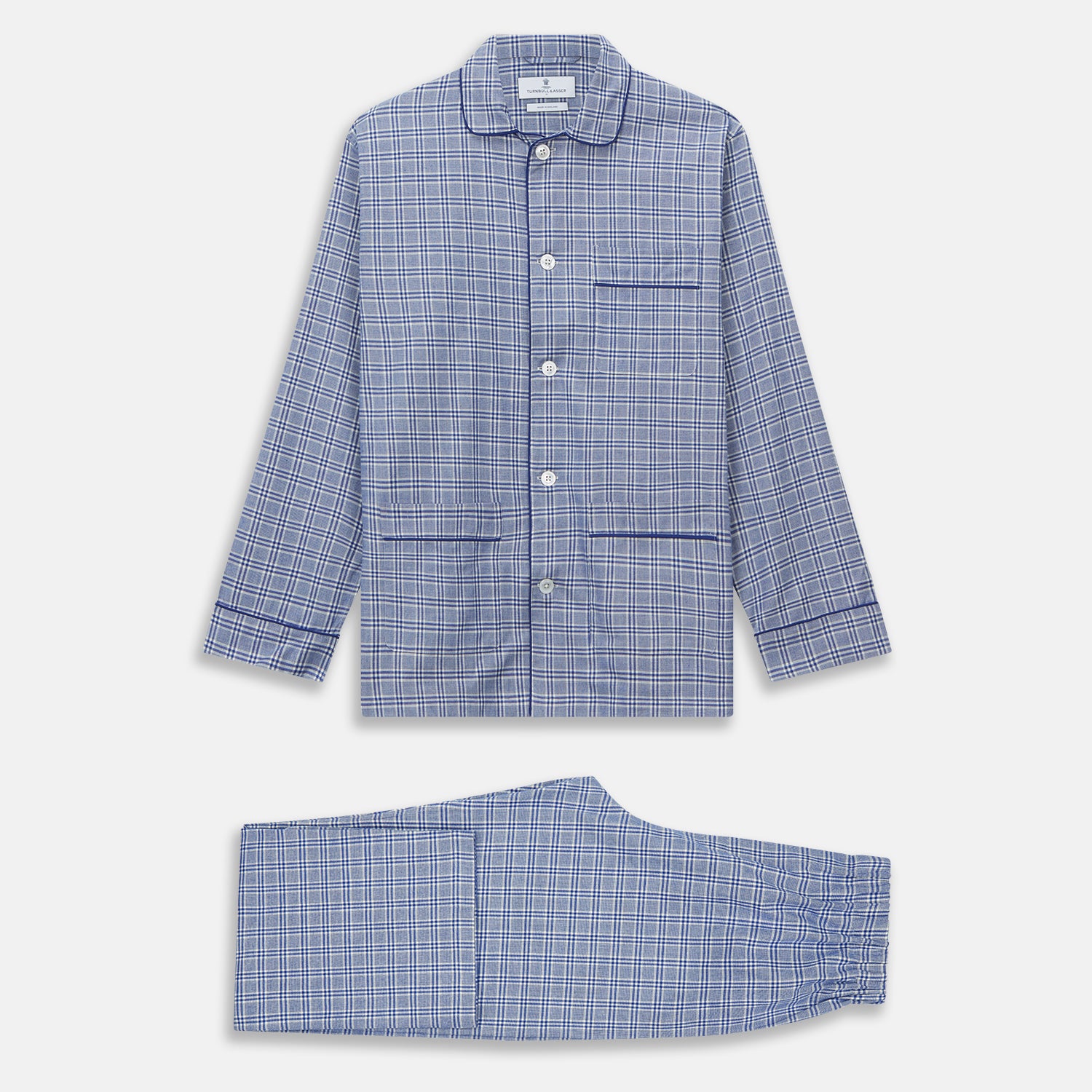 View 6 of product The Turnbull & Asser Blue Check Modern Cotton Pyjama Set features a long-sleeve button-up top and matching pants, crafted from thicker cotton for added comfort, shown against a white background.