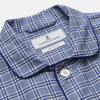 View 2 of product The Turnbull & Asser Blue Check Modern Cotton Pyjama Set features a long-sleeve button-up top and matching pants, crafted from thicker cotton for added comfort, shown against a white background.