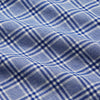 View 4 of product The Turnbull & Asser Blue Check Modern Cotton Pyjama Set features a long-sleeve button-up top and matching pants, crafted from thicker cotton for added comfort, shown against a white background.
