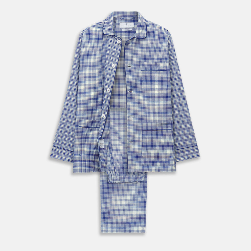 The Turnbull & Asser Blue Check Modern Cotton Pyjama Set features a long-sleeve button-up top and matching pants, crafted from thicker cotton for added comfort, shown against a white background.