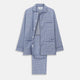 The Turnbull & Asser Blue Check Modern Cotton Pyjama Set features a long-sleeve button-up top and matching pants, crafted from thicker cotton for added comfort, shown against a white background.