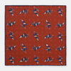 View 1 of product The Turnbull & Asser Red Windsurfer Double-Faced Silk Print Pocket Square features a vibrant windsurfer pattern on silk with a dark blue border and the brand subtly printed in one corner.