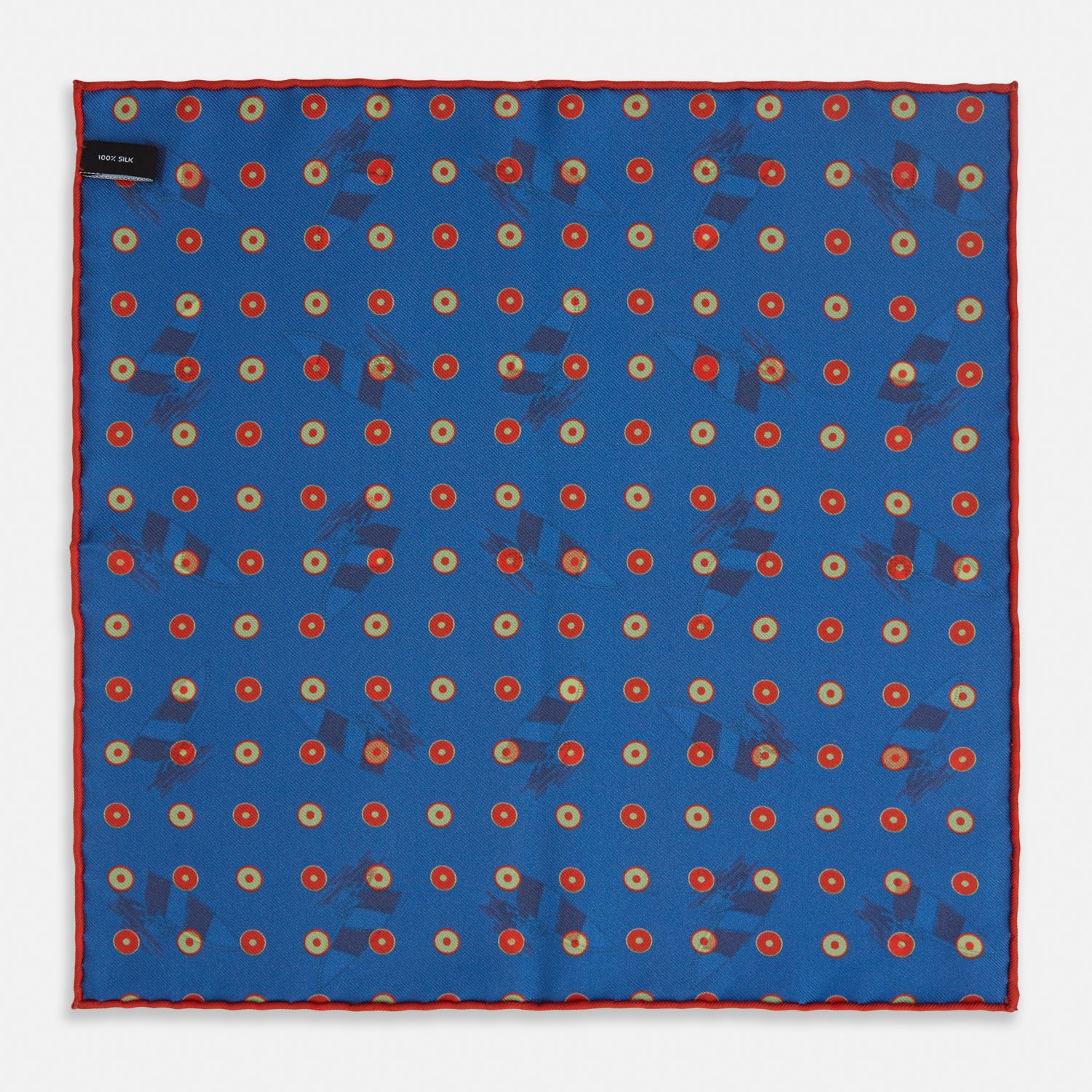 View 2 of product The Turnbull & Asser Blue Windsurfer Double-Faced Silk Print Pocket Square features a blue silk design with colorful windsurfers and vivid red edges, finished with the Turnbull & Asser logo in one corner.