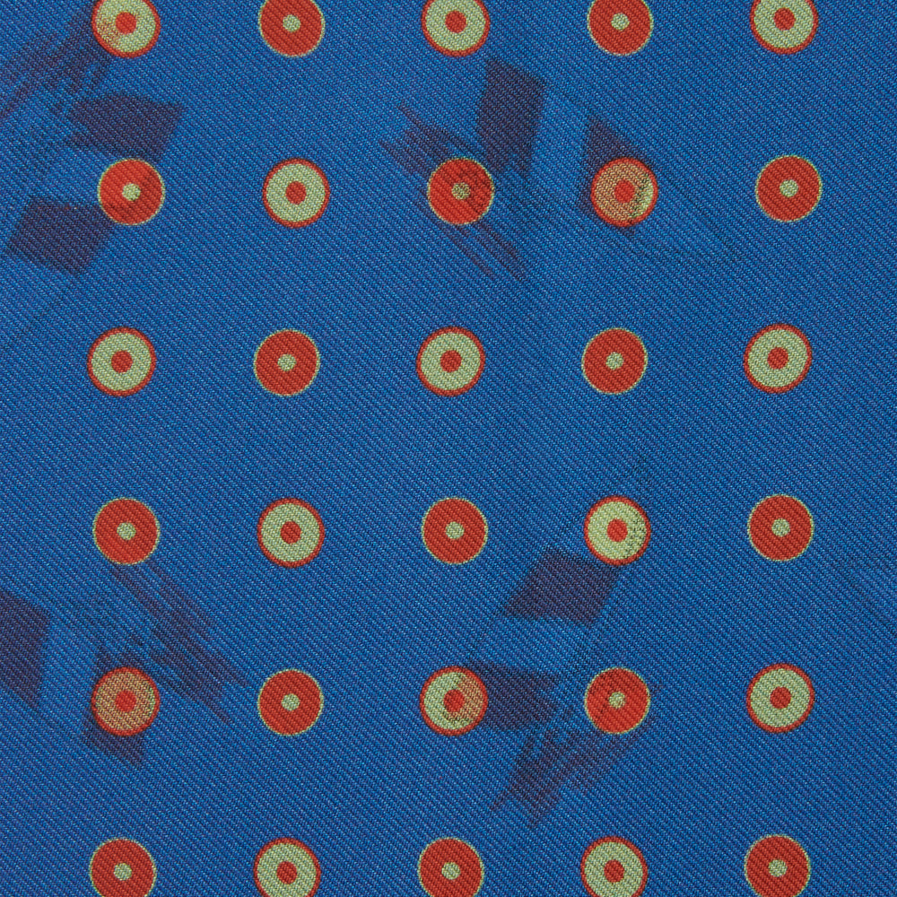 The Turnbull & Asser Blue Windsurfer Double-Faced Silk Print Pocket Square features a blue silk design with colorful windsurfers and vivid red edges, finished with the Turnbull & Asser logo in one corner.