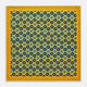 The Yellow Medallion Print Silk Pocket Square by Turnbull & Asser features blue hexagons with ochre yellow centers on a dark blue background, bordered by a dotted ochre yellow frame—a stylish accessory for any suit.