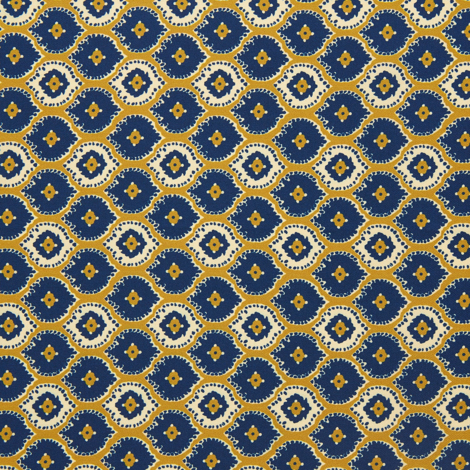 View 3 of product The Tan Medallion Print Silk Pocket Square by Turnbull & Asser features an elegant medallion geometric pattern in blue, white, and gold with central diamond shapes and a gold dotted border on luxurious silk.
