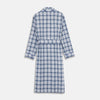 View 5 of product The Turnbull & Asser Blue Check Cotton Gown features long sleeves, a knee-length cut, shawl collar, and matching waist belt in a blue check pattern, shown against a plain white background.