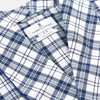 View 2 of product The Turnbull & Asser Blue Check Cotton Gown features long sleeves, a knee-length cut, shawl collar, and matching waist belt in a blue check pattern, shown against a plain white background.