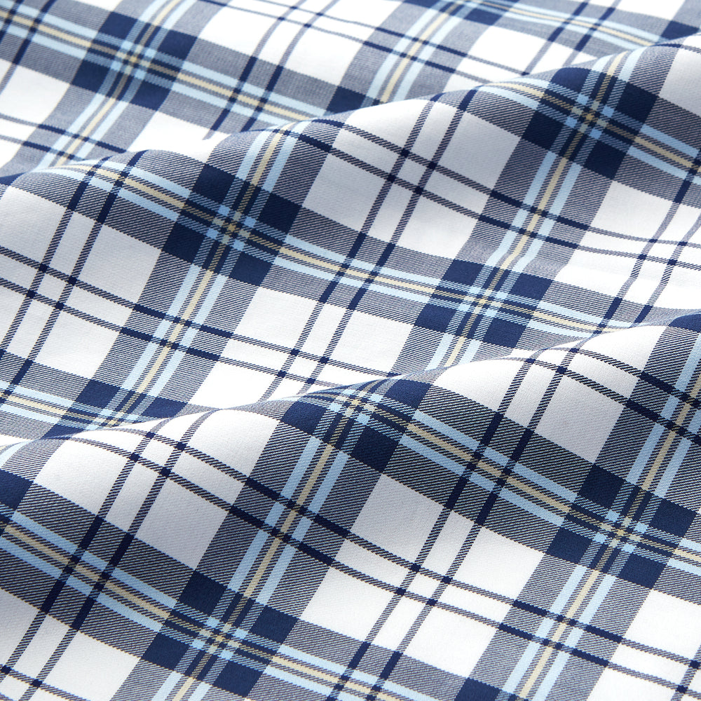 The Turnbull & Asser Blue Check Cotton Gown features long sleeves, a knee-length cut, shawl collar, and matching waist belt in a blue check pattern, shown against a plain white background.
