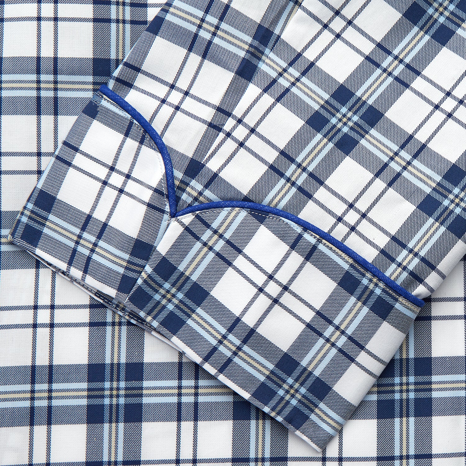 View 3 of product The Turnbull & Asser Blue Check Cotton Gown features long sleeves, a knee-length cut, shawl collar, and matching waist belt in a blue check pattern, shown against a plain white background.