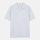 The Turnbull & Asser Blue Linen Stripe Holiday Fit Shirt features short sleeves, a revere collar, and single chest pocket, perfect for resort wear. Shown on a plain white background.