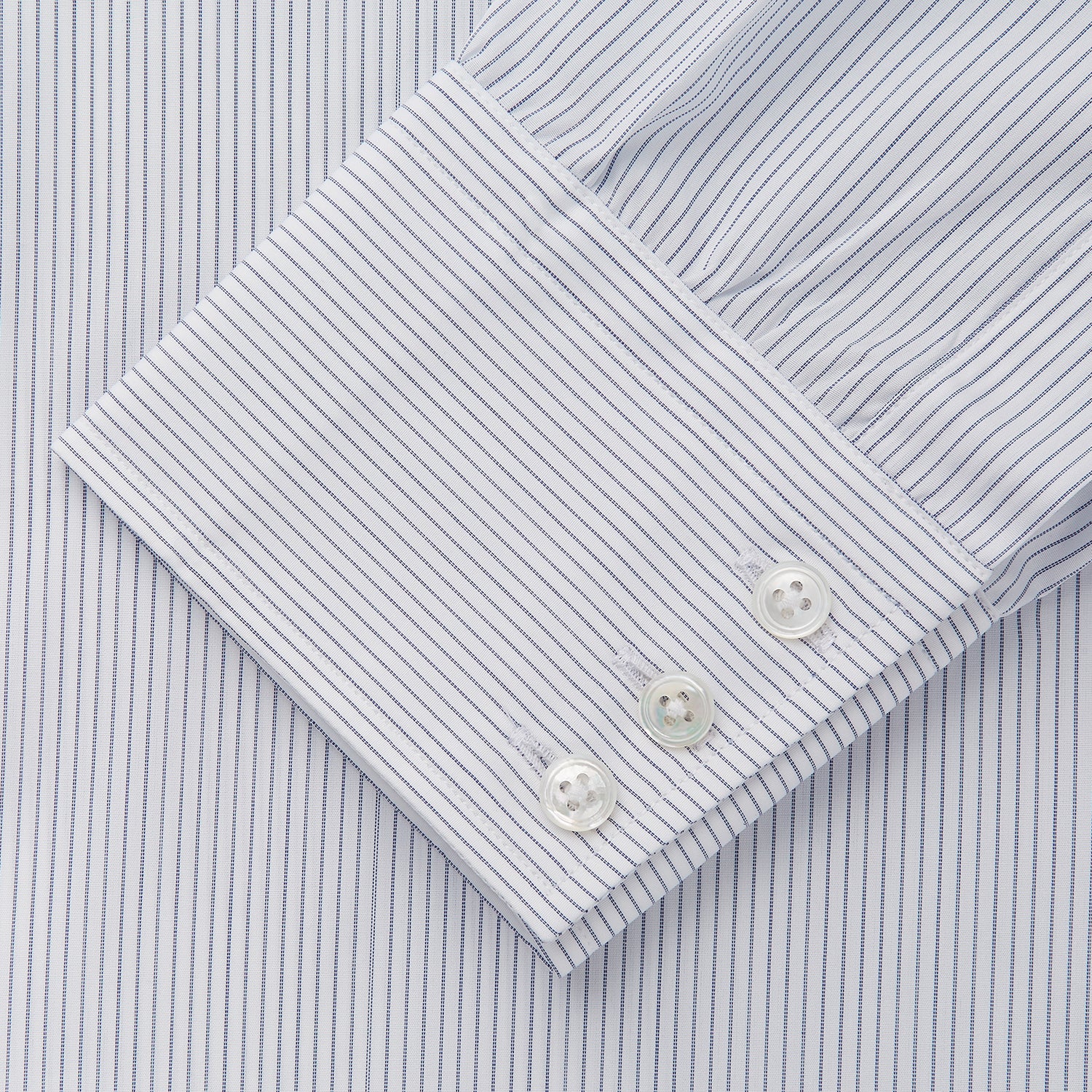 View 3 of product Turnbull & Asser Blue & White Stripe Sea Island Quality Cotton Regular Fit Mayfair shirt with a classic collar and buttoned cuffs, laid flat on a white background.