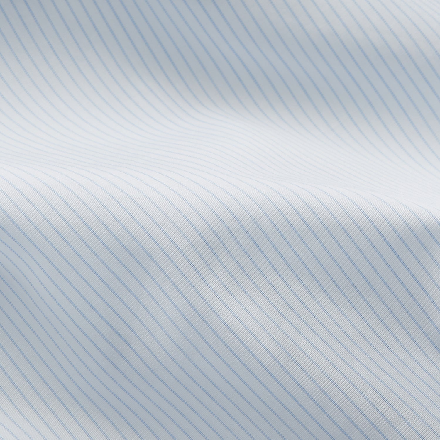 View 4 of product The Turnbull & Asser Pale Blue Stripe Regular Fit Sea Island Quality Cotton Shirt features a T&A collar and 3-button cuffs, laid flat on a white background.