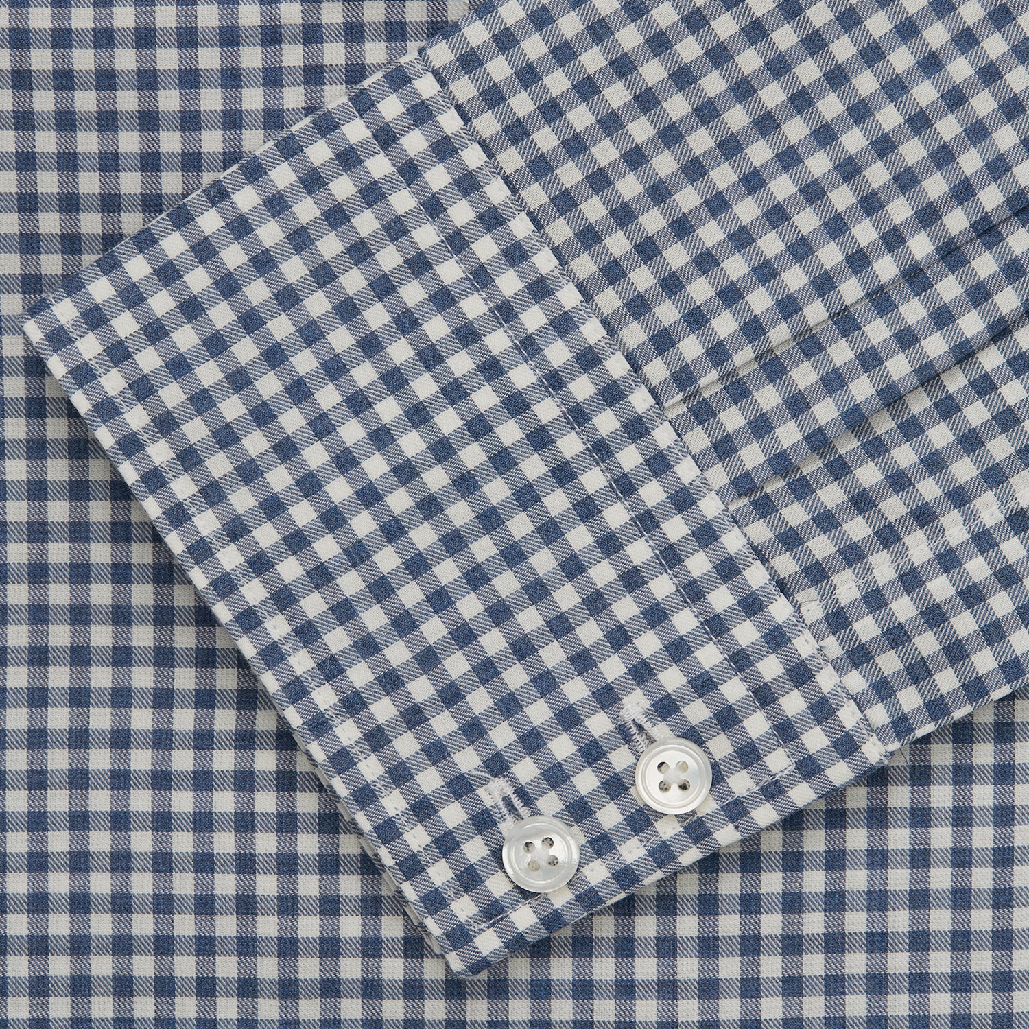 View 5 of product The Turnbull & Asser Blue Multi Check Tailored Fit Shirt features a Kent collar, 2-button cuffs, and a fine blue and white checked pattern—an essential men's wardrobe piece—shown flat on a white background.