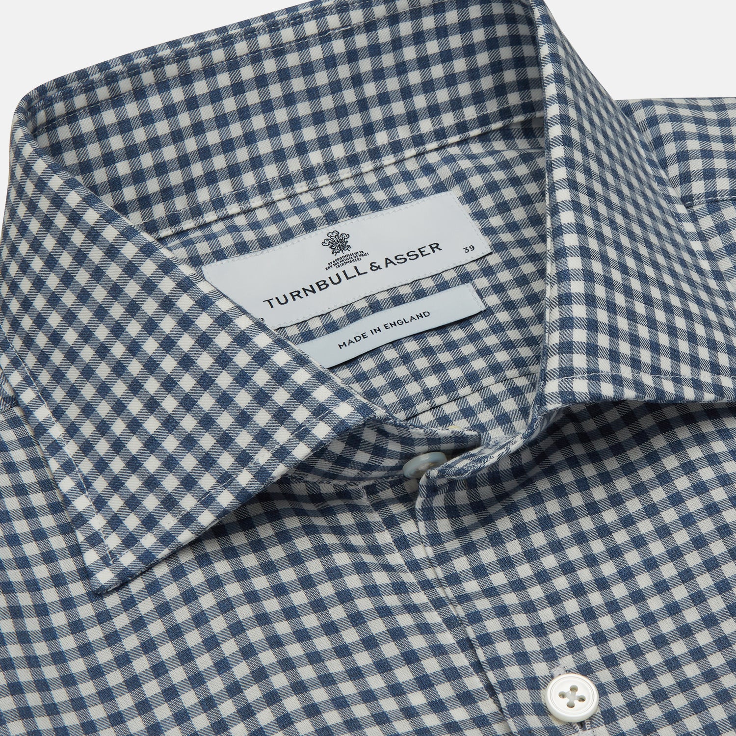 View 4 of product The Turnbull & Asser Blue Multi Check Tailored Fit Shirt features a Kent collar, 2-button cuffs, and a fine blue and white checked pattern—an essential men's wardrobe piece—shown flat on a white background.