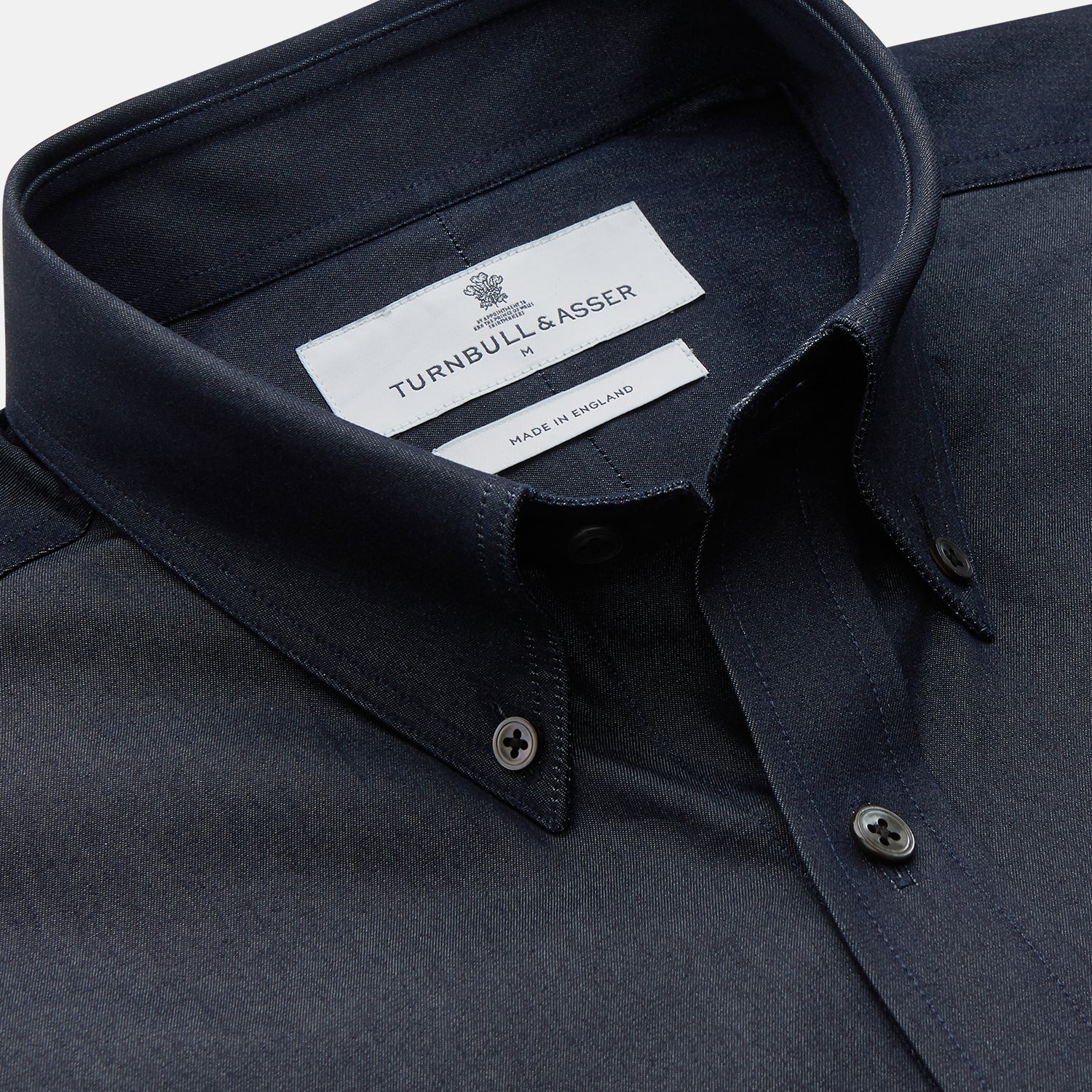 View 2 of product The Turnbull & Asser Navy Chambray Weekend Fit Shirt features a Dorset collar, long sleeves with 1-button cuffs, and two button-flap chest pockets. This officer’s shirt is displayed flat on a white background.