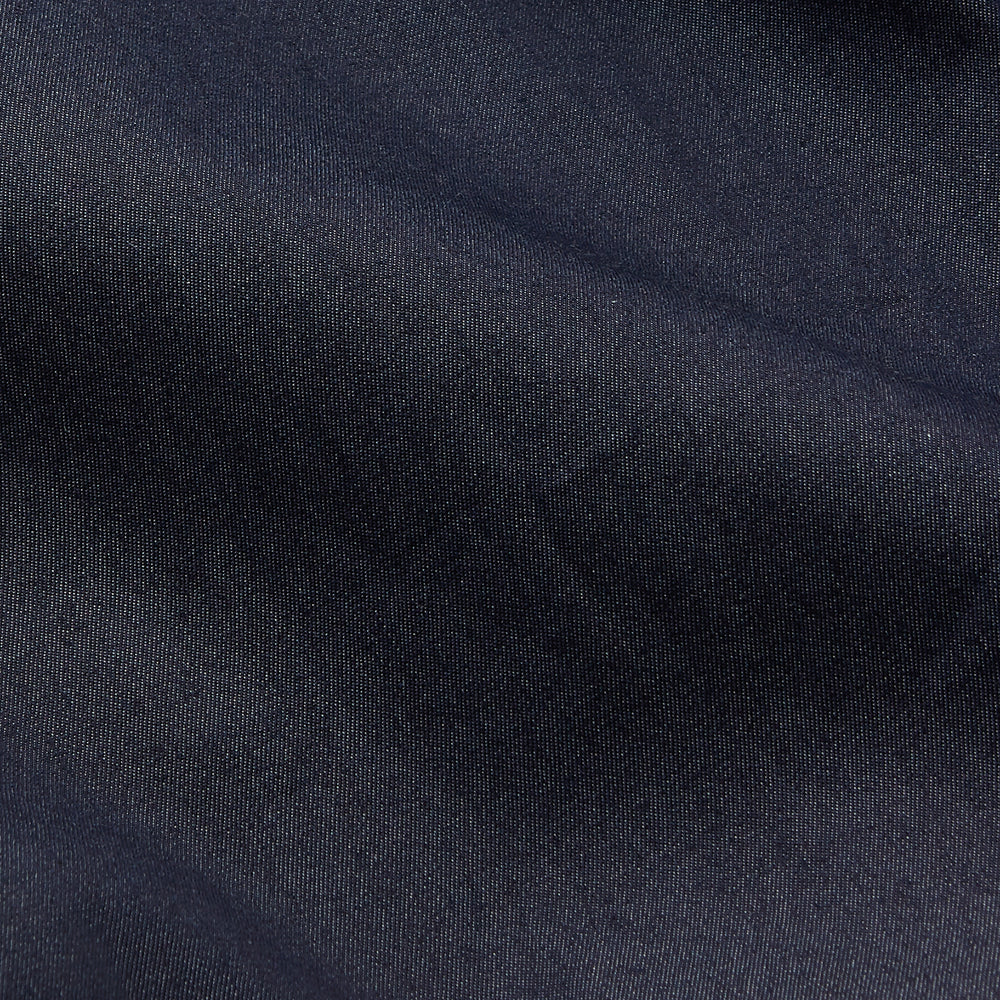 The Turnbull & Asser Navy Chambray Weekend Fit Shirt features a Dorset collar, long sleeves with 1-button cuffs, and two button-flap chest pockets. This officer’s shirt is displayed flat on a white background.