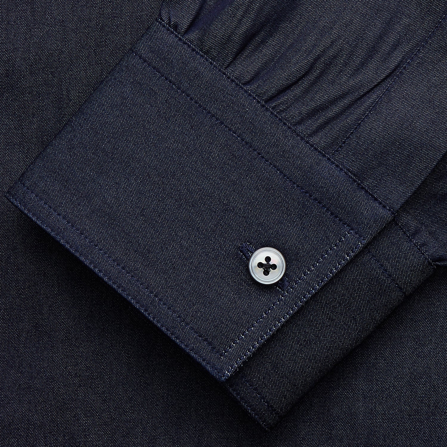 View 3 of product The Turnbull & Asser Navy Chambray Weekend Fit Shirt features a Dorset collar, long sleeves with 1-button cuffs, and two button-flap chest pockets. This officer’s shirt is displayed flat on a white background.