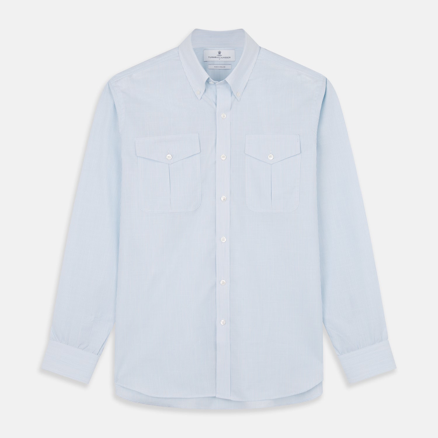 View 1 of product The Turnbull & Asser Sky Blue Chambray Stripe Weekend Fit Shirt features a Dorset collar, long sleeves, and two button-flap chest pockets, offering a relaxed look. Displayed on a plain white background.
