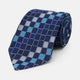 The Blue Multi Check Silk Tie by Turnbull & Asser features a geometric checked pattern in blue, light blue, and silver on dark navy—ideal for pairing with bold shirts.