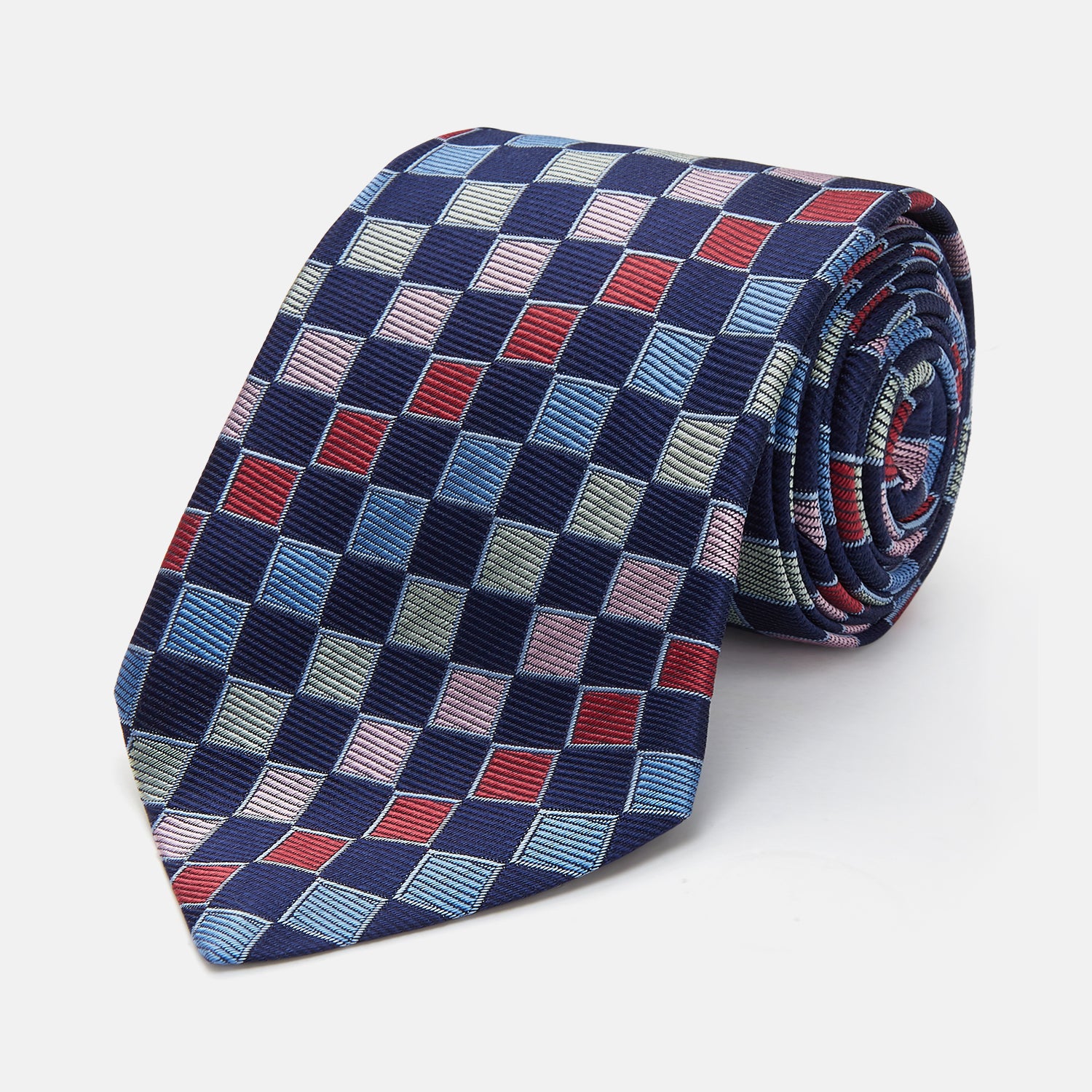 View 1 of product The Pink Multi Check Silk Tie by Turnbull & Asser features blue, red, and light green squares on a white background—an ideal summer accessory that complements bold shirts.