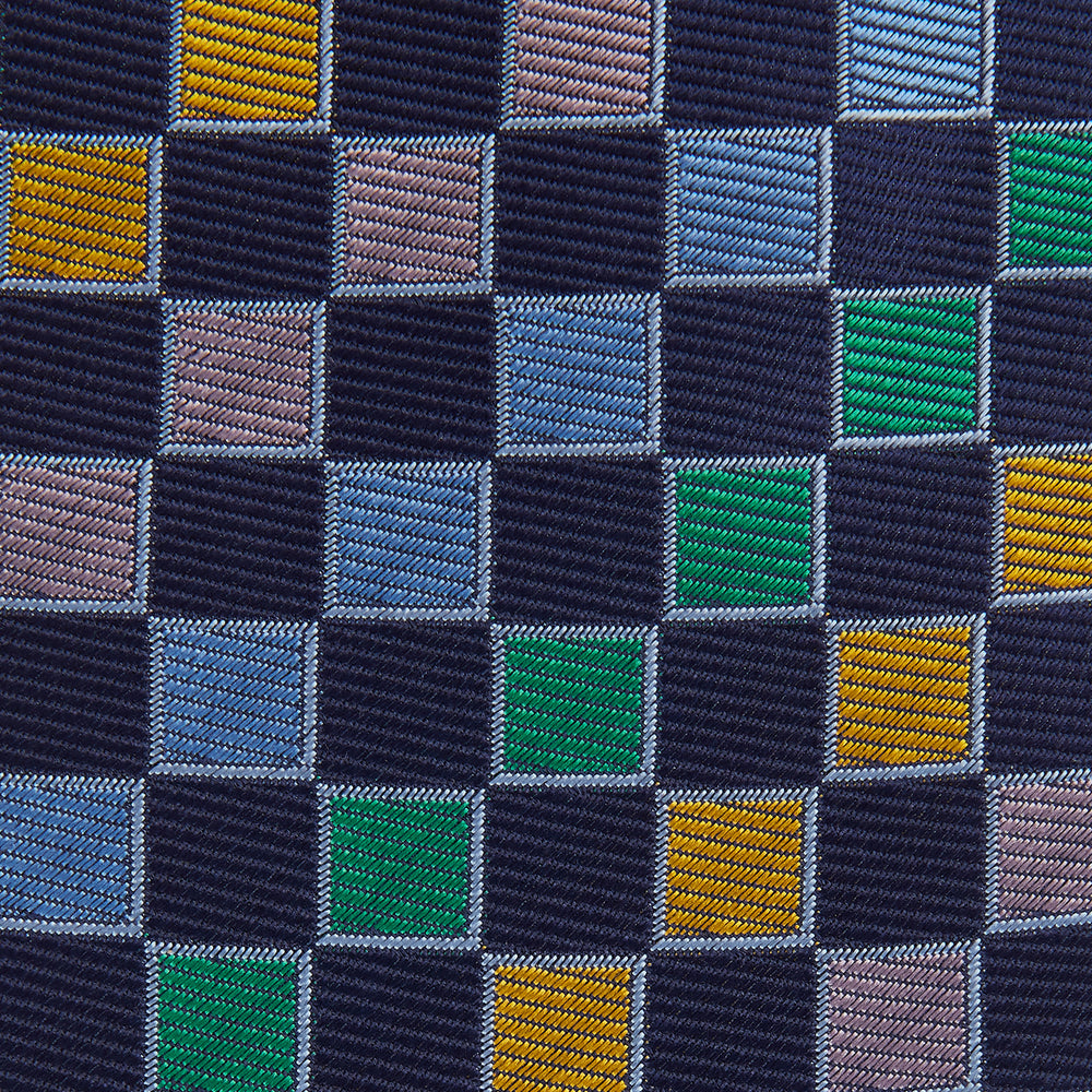 The Green Multi Check Silk Tie by Turnbull & Asser features a green checkered pattern with blue, yellow, and light purple squares on dark blue—ideal for bold shirts and a vibrant summer palette.