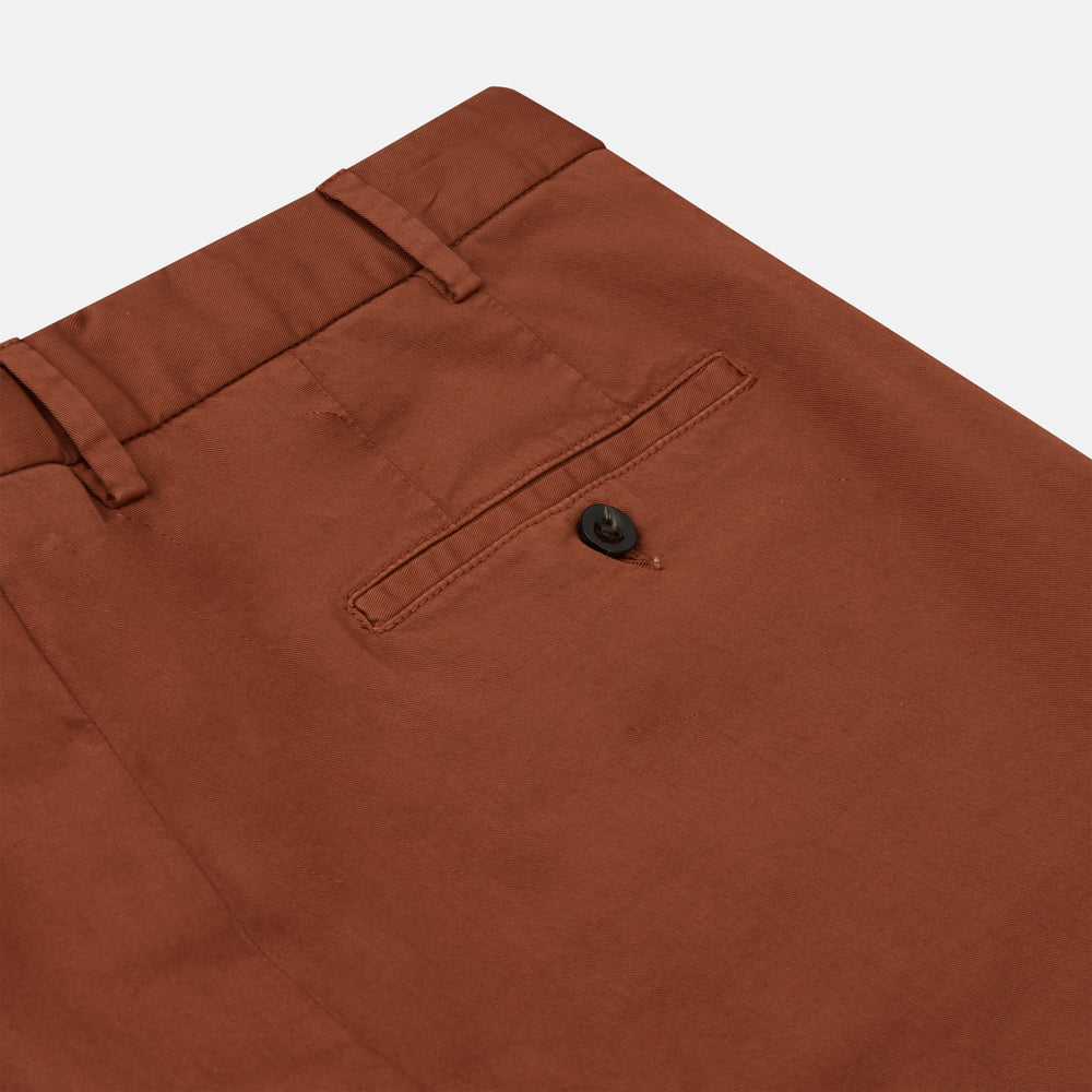 The Turnbull & Asser Orange Classic Chino Manson Trouser, crafted from cotton twill in Italy with a straight-leg fit and button-zip closure, is displayed flat against a plain white background.
