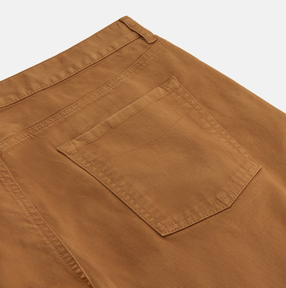 Tan Stretch Cotton Five-Pocket Mylo Jeans by Turnbull & Asser, featuring a classic straight-leg cut, are displayed flat on a white background—showcasing timeless style and quality craftsmanship.