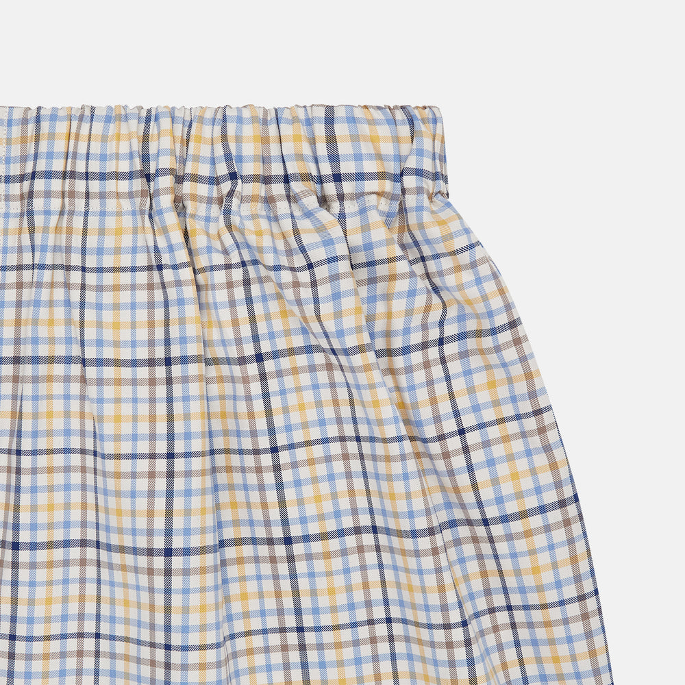 Turnbull & Asser Yellow Multi Check Cotton Boxer Shorts for men feature a loose fit, elastic waistband, and soft cotton fabric in a light blue, yellow, and white plaid pattern, shown against a plain white background.