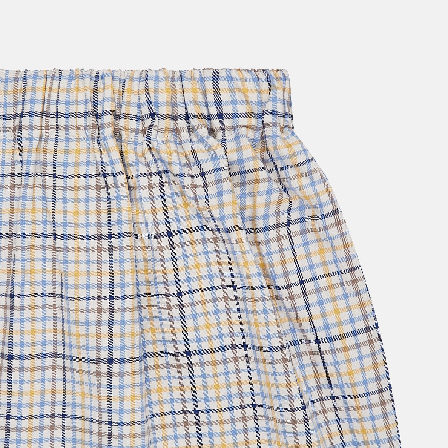 View 2 of product Turnbull & Asser Yellow Multi Check Cotton Boxer Shorts for men feature a loose fit, elastic waistband, and soft cotton fabric in a light blue, yellow, and white plaid pattern, shown against a plain white background.