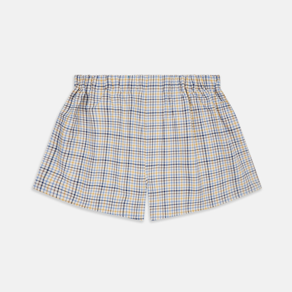 Turnbull & Asser Yellow Multi Check Cotton Boxer Shorts for men feature a loose fit, elastic waistband, and soft cotton fabric in a light blue, yellow, and white plaid pattern, shown against a plain white background.