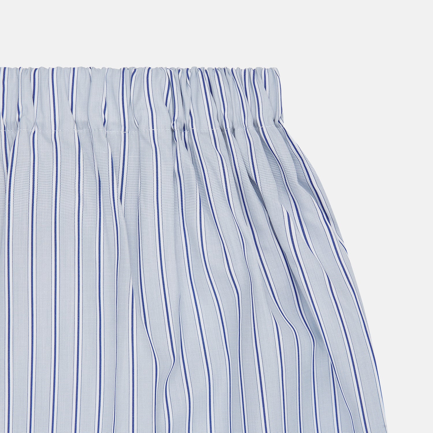 View 2 of product Turnbull & Asser Navy & Blue Stripe Cotton Boxer Shorts feature a white base with light blue and navy pinstripes and an elastic waistband for added comfort.