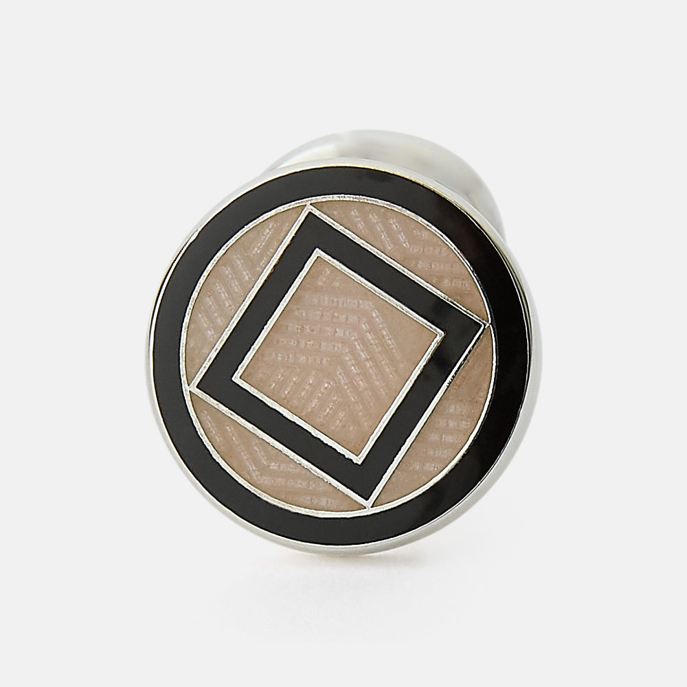 Turnbull & Asser's Pale Pink Sterling Silver Cufflinks feature a round design with a geometric square pattern on a pale pink background—an elegant accessory for men, displayed on a white surface.