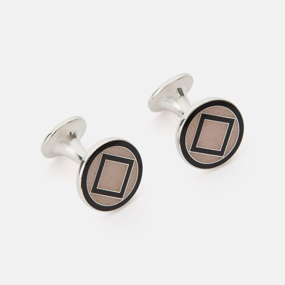 Turnbull & Asser's Pale Pink Sterling Silver Cufflinks feature a round design with a geometric square pattern on a pale pink background—an elegant accessory for men, displayed on a white surface.