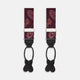 Two red paisley adjustable silk braces by Turnbull & Asser, featuring leather ends and silver clasps, are laid out vertically side by side on a white background.