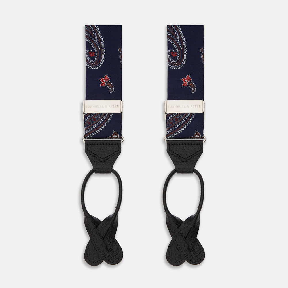 A pair of Navy Paisley Adjustable Silk Braces by Turnbull & Asser, featuring black leather loops and silver-tone adjusters, is displayed on a white background.