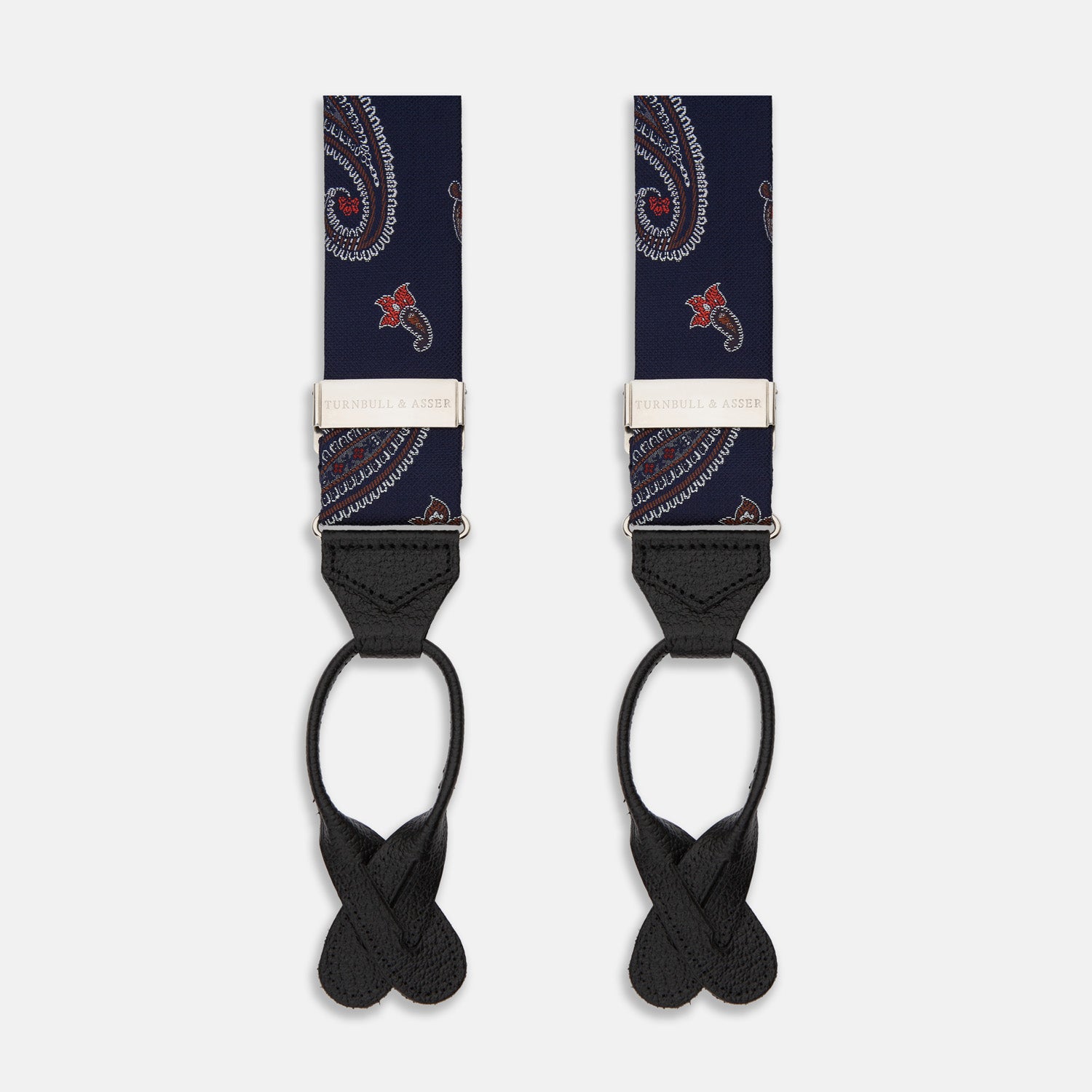 View 1 of product A pair of Navy Paisley Adjustable Silk Braces by Turnbull & Asser, featuring black leather loops and silver-tone adjusters, is displayed on a white background.