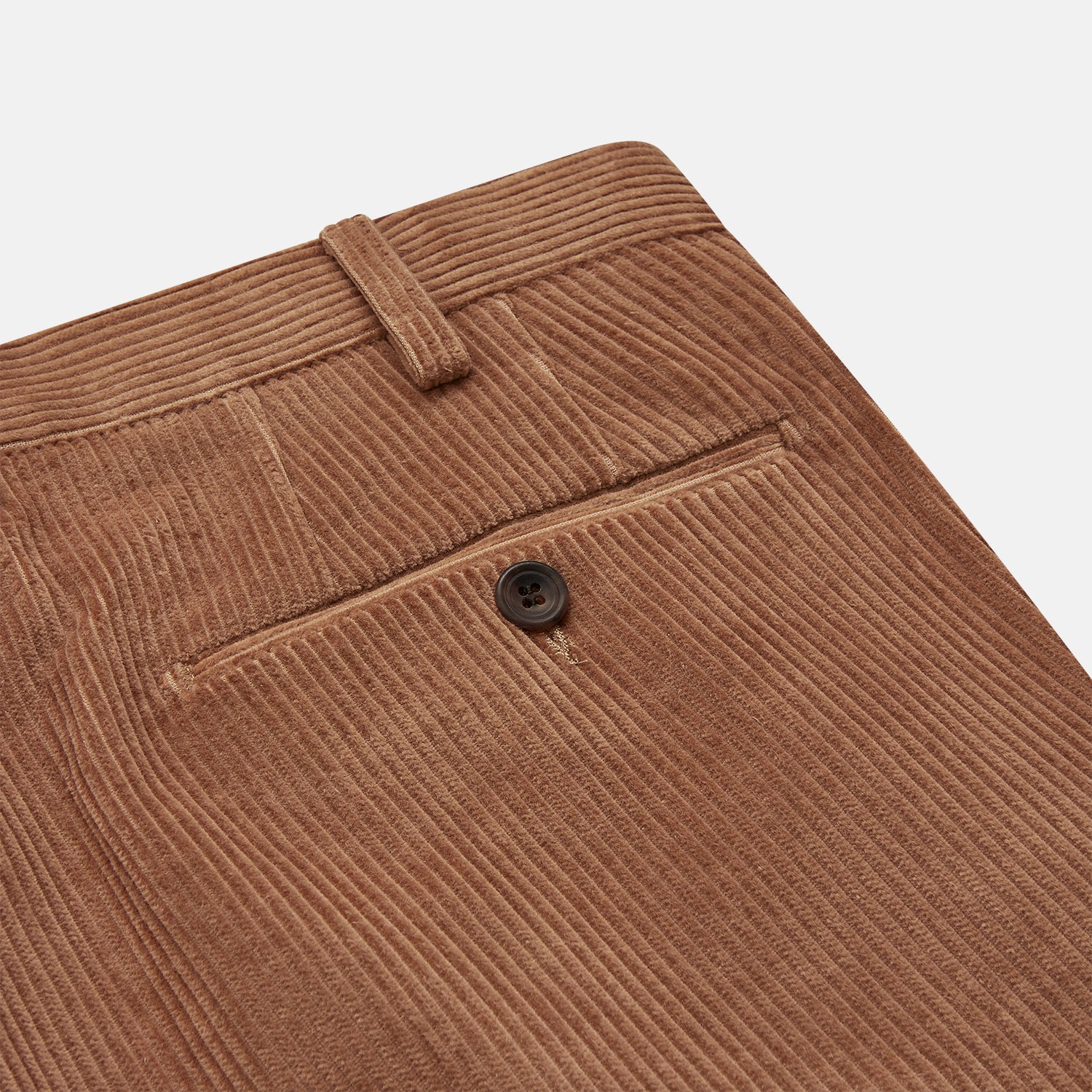 View 2 of product Turnbull & Asser’s Fawn Horizontal Cord Manson Trouser, tailored in Italy from brown cotton cord with straight legs, belt loops, and front button-zip closure, is shown laid flat on a white background.
